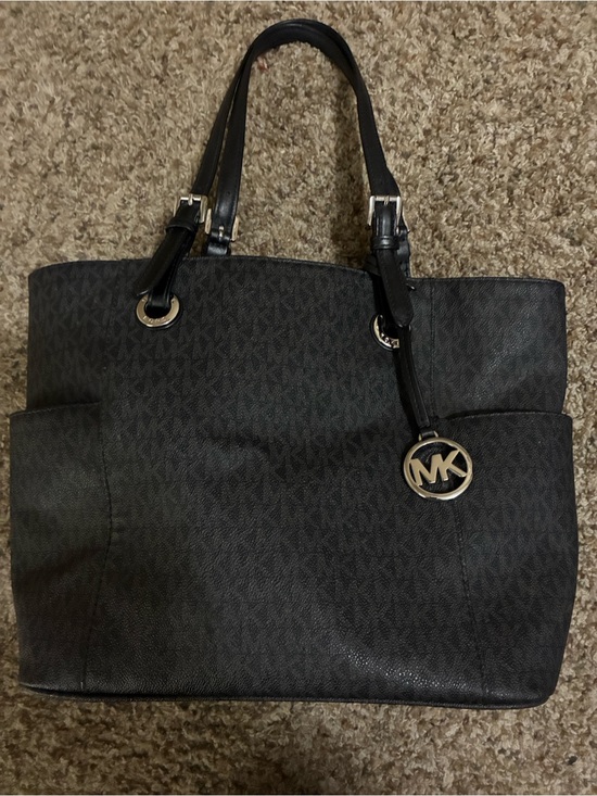 Michael Kors Handbags - Michael Kors Black Logo Jet Set tote with MK Charm and Side Pockets